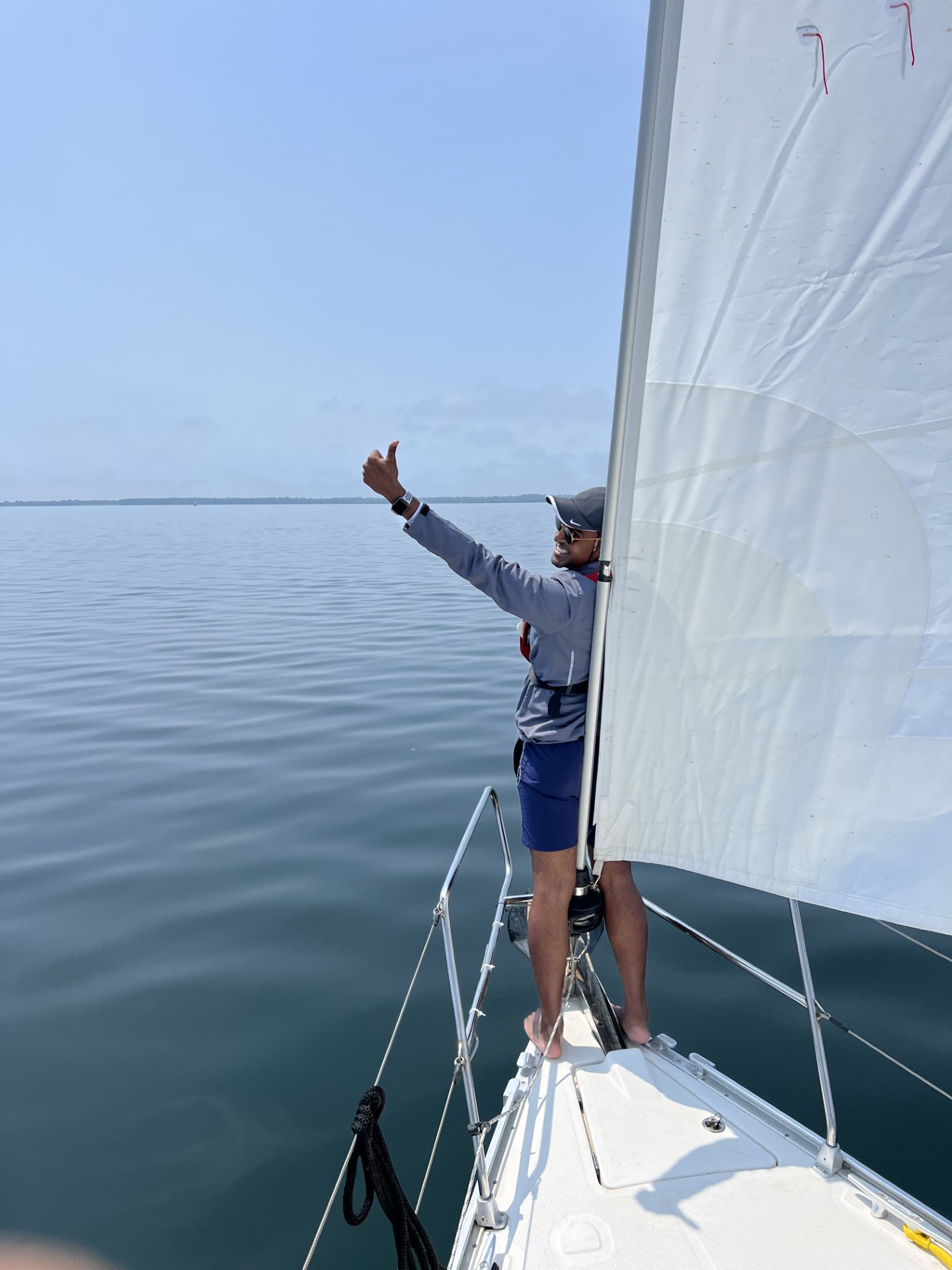 Student on the foredeck giving thumbs up