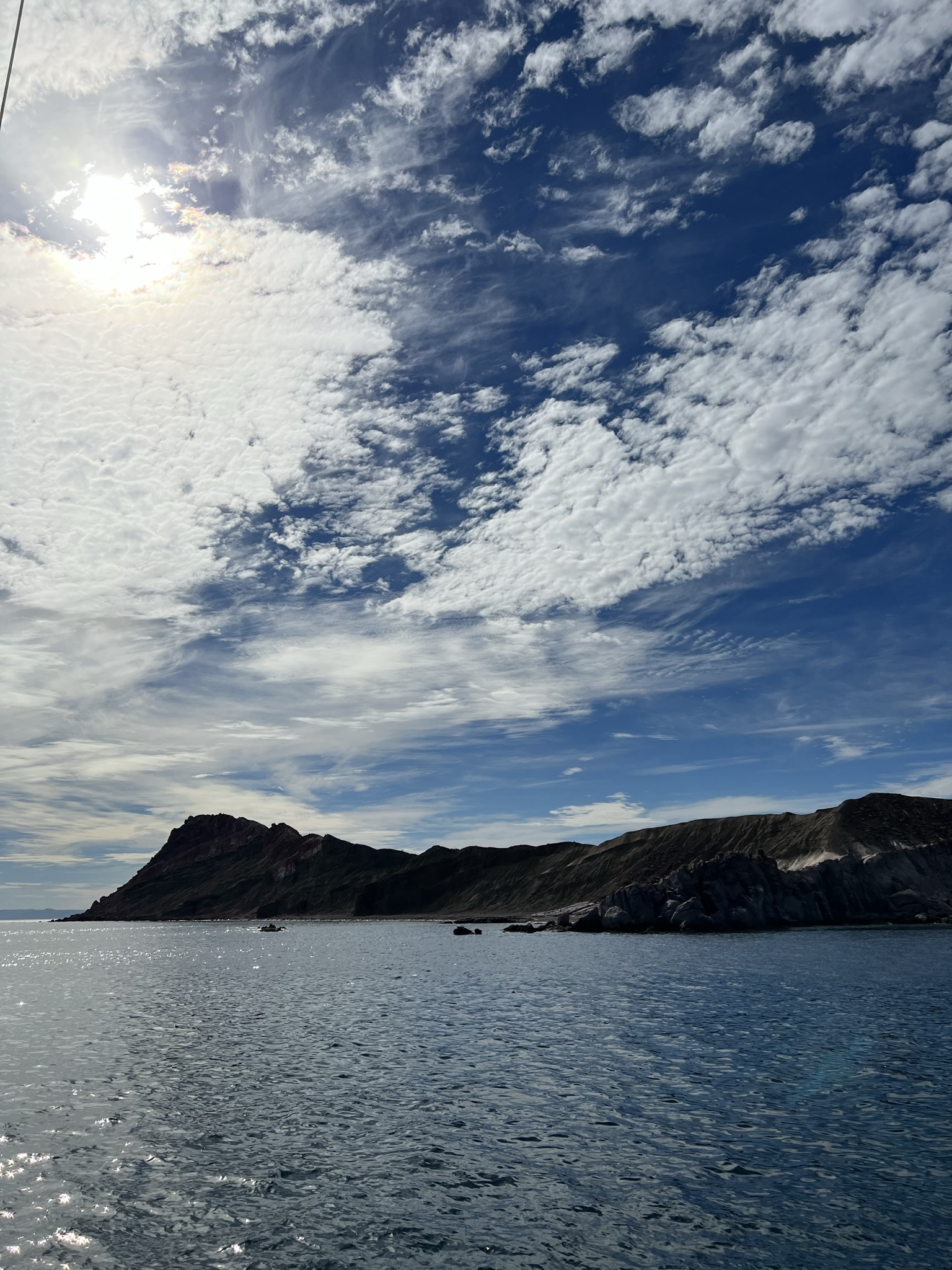 Island headland under a high desert sky