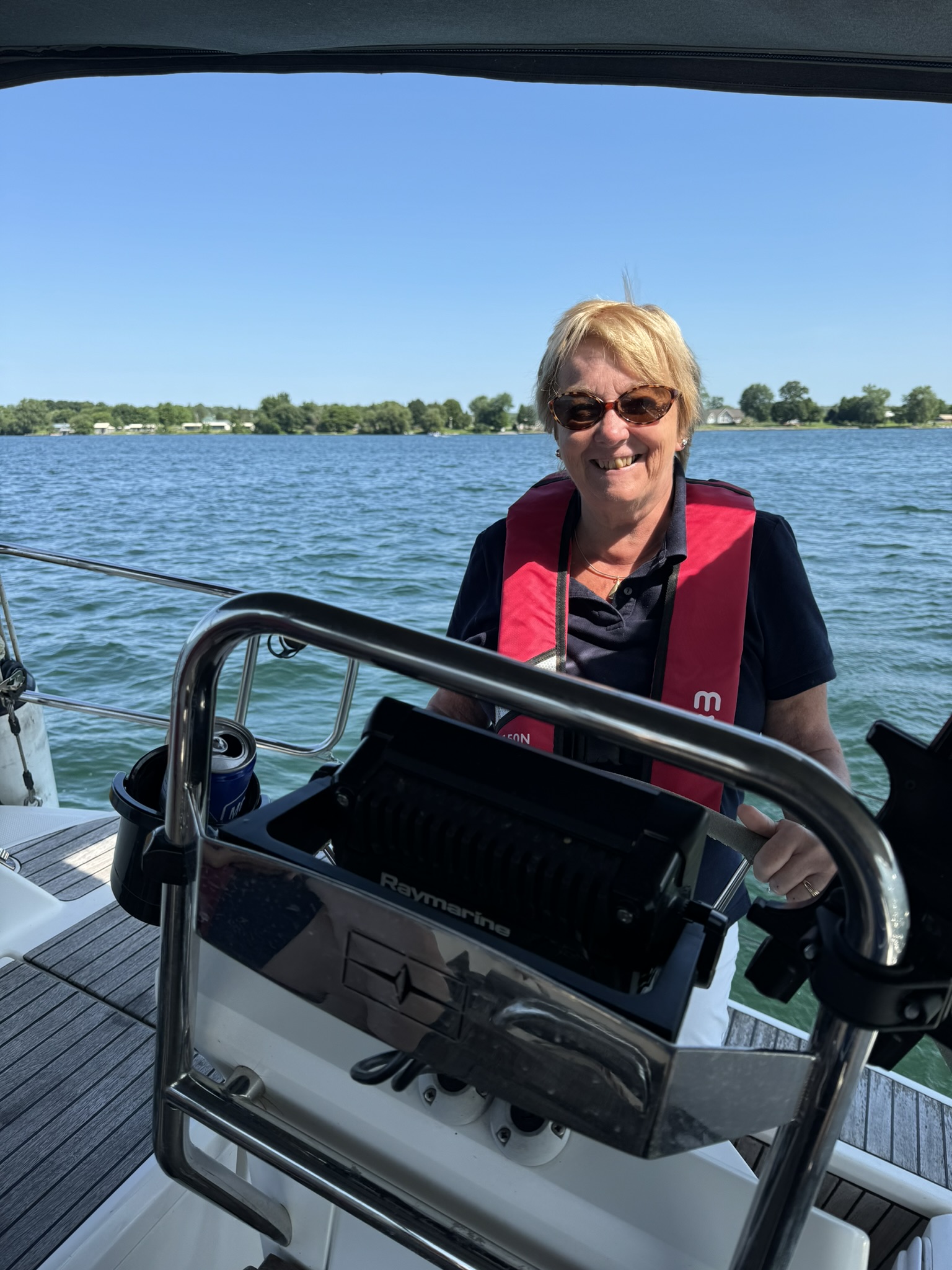 Student at the helm learning keelboat sailing